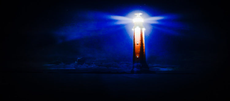 image of a lighthouse directing light to help navigate safely