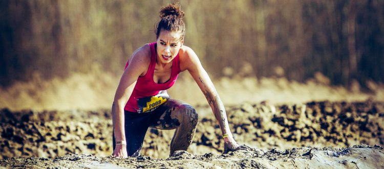 picture of an athlete running through a tough environment
